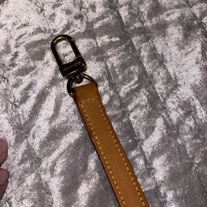 Louis Vuitton strap size is 38 1/2“ long no stains excellent condition.